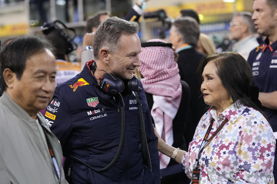 Red Bull co-owner Chalerm Yoovidhya, left, and his wife Daranee, right, speak with Red Bull team principal Christian Horner during the Formula One Bahrain Grand Prix at the Bahrain International Circuit in Sakhir, Bahrain, Saturday, March 2, 2024. (AP Photo/Darko Bandic)