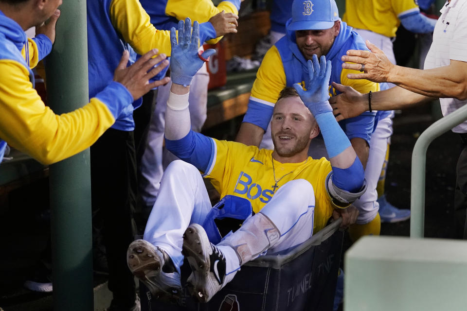 Boston Red Sox's Trevor Story is congratulated after his three run home run off Detroit Tigers starting pitcher Beau Brieske during the fourth inning of a baseball game, Tuesday, June 21, 2022, at Fenway Park in Boston. (AP Photo/Charles Krupa)