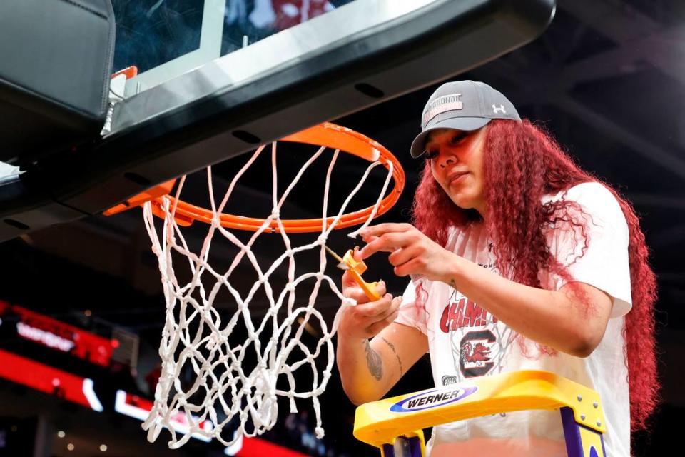 South Carolina’s Kamilla Cardoso (10) cuts a piece of the net after winning the National Championship after beating Iowa at the Rocket Mortgage FieldHouse in Cleveland, Ohio on Sunday April 7, 2024.