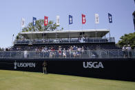 Fans sit in the stands on the 18th hole during the third round of the U.S. Open golf tournament at Los Angeles Country Club on Saturday, June 17, 2023, in Los Angeles. (AP Photo/George Walker IV)