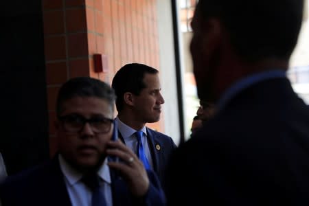 Venezuelan opposition leader Juan Guaido, who many nations have recognized as the country's rightful interim ruler, arrives to a news conference in Caracas