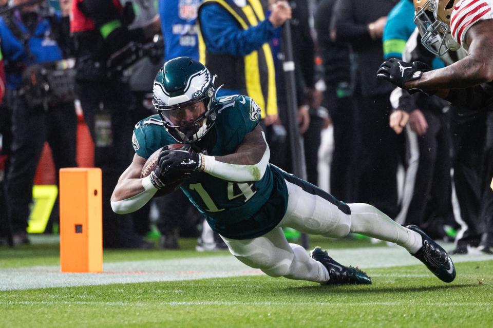 Dec 3, 2023; Philadelphia, Pennsylvania, USA; PhiladelSphia Eagles running back Kenneth Gainwell (14) dives for a first down against the San Francisco 49ers during the first quarter at Lincoln Financial Field. Mandatory Credit: Bill Streicher-USA TODAY Sports