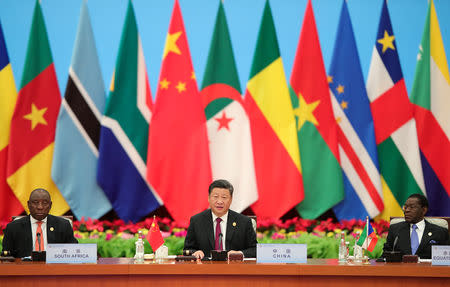 Chinese President Xi Jinping speaks next to South African President Cyril Ramaphosa during the 2018 Beijing Summit Of The Forum On China-Africa Cooperation - Round Table Conference at at the Great Hall of the People in Beijing on September 4, 2018 in Beijing, China. Lintao Zhang/Pool via REUTERS