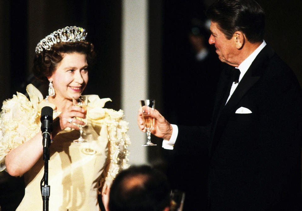 Queen Elizabeth ll toasts President Ronald Reagan at a banquet during the Queen's official visit to the US in March 1983 in San Francisco, CA. (Anwar Hussein / Getty Images)