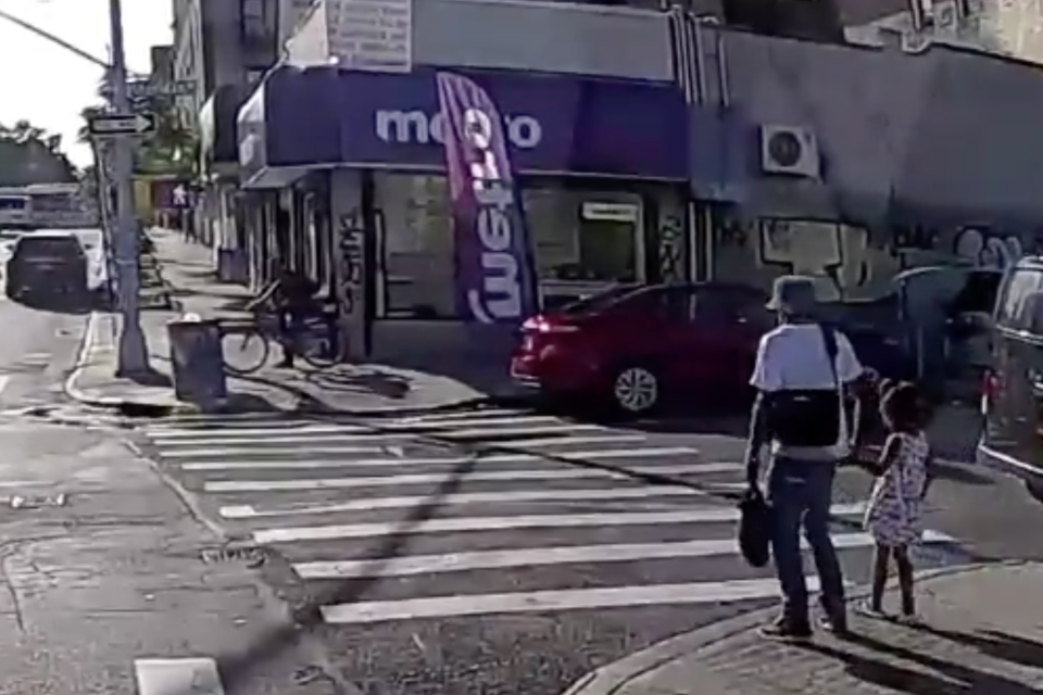 The father was seen holding his daughter's hand as they crossed the road (NYPD)