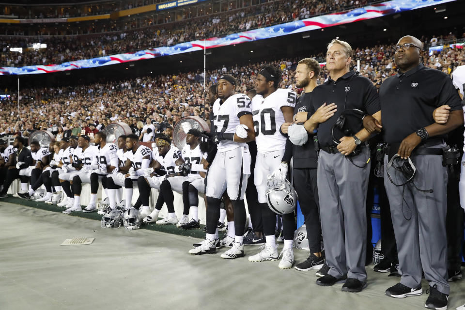 <p>Some members of the Oakland Raiders sit on the bench during the national anthem before an NFL football game against the Washington Redskins in Landover, Md., Sept. 24, 2017. (Photo: Alex Brandon/AP) </p>