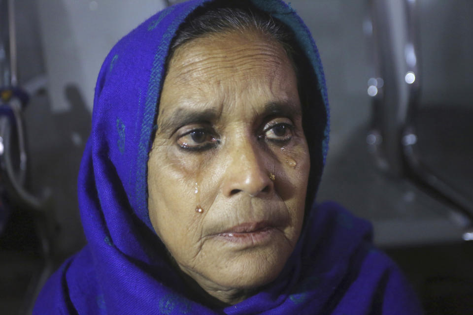 Indian passenger Saira cries as she arrives at Lahore railway station to travel to India, in Lahore, Pakistan, Thursday, Feb. 28, 2019. The Pakistan government temporally suspended the operation of the Samjhuta Express that runs from Lahore to New Delhi, India, after escalation of tensions between the nuclear-armed rivals. (AP Photo/K.M. Chaudary)