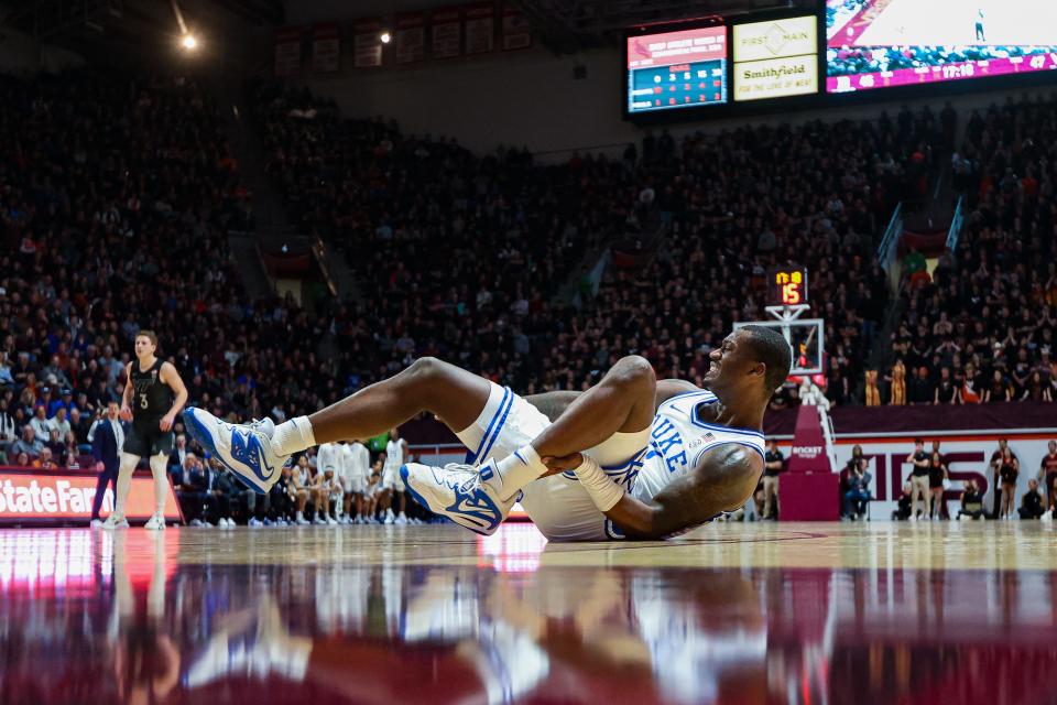 BLACKSBURG, VA - JANUARY 23: Forward Dariq Whitehead #0 of the Duke Blue Devils grabs his leg following an injury in the second half during a game against the Virginia Tech Hokies at Cassell Coliseum on January 23, 2023 in Blacksburg, Virginia. (Photo by Ryan Hunt/Getty Images)