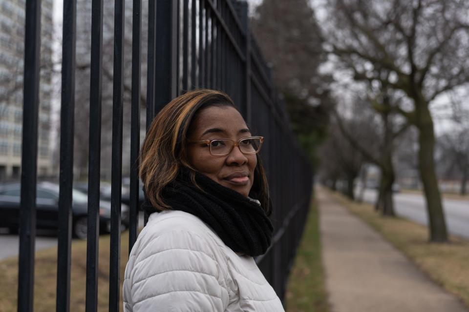 Clarissa Glenn, 52, stands on the corner of 37th Street and South Rhodes Avenue near the former Ida B. Wells Homes Extension in Chicago where she was once lived, on Dec. 10, 2022.