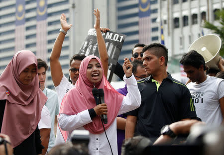 Organizer of student activists Anis Syafiqah Md Yusof speaks to participants near Dataran Merdeka, or Independence Square, during a march to call for the arrest of "Malaysian Official 1" in Kuala Lumpur, Malaysia August 27, 2016. REUTERS/Edgar Su