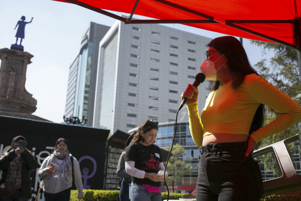 Acid attack survivor Maria Elena Ríos speaks during a resistance meeting at the Monument to Women in Struggle, on Reforma Avenue in Mexico City, Saturday, Feb. 4, 2023. Ríos, 29, has joined a push among activists for stronger punishments for acid attacks. (AP Photo/Ginnette Riquelme)