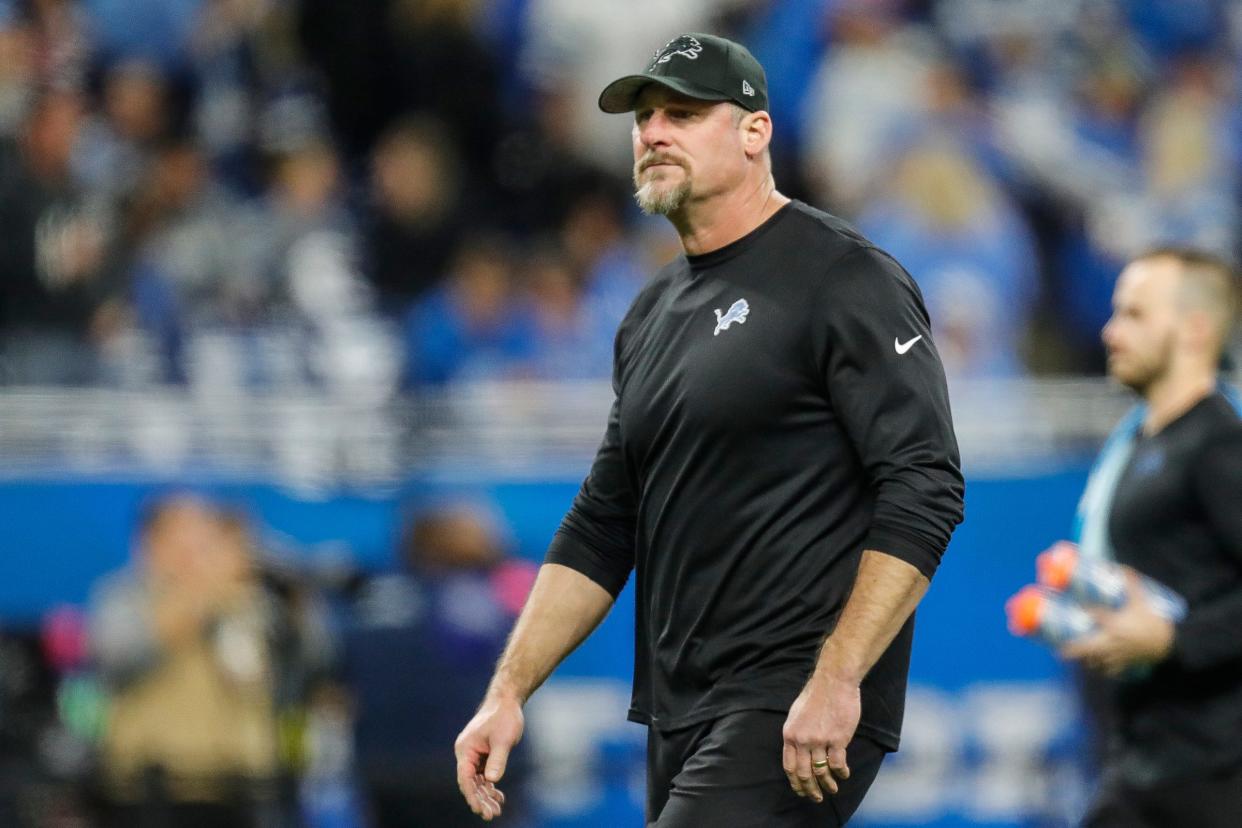 Dan Campbell watches warmups before the NFC divisional playoff game between the Lions and Buccaneers at Ford Field on Sunday, Jan. 21, 2024.