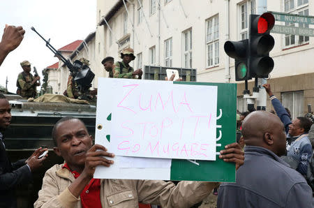 Protesters calling for Zimbabwean President Robert Mugabe to step down take to the streets in Harare, Zimbabwe November 18, 2017. REUTERS/Philimon Bulawayo