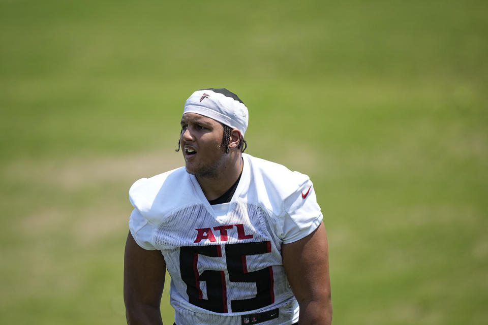 Atlanta Falcons offensive lineman Matthew Bergeron (65) stretches during the NFL football team's rookie minicamp, Saturday, May 13, 2023, in Flowery Branch, Ga. (AP Photo/Brynn Anderson)