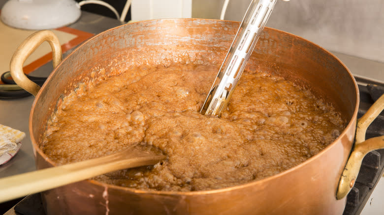 boiling fudge syrup with thermometer