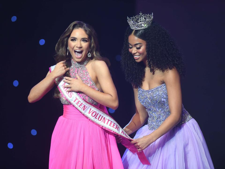 Newly crowned Miss Teen Volunteer America 2025 Anna Grace Loudenbeck has her sachel placed on her by Miss Teen Volunteer America 2024 Ayzjiahna Wood during the last night of the 2025 Miss Teen Volunteer America Pageant inside Carl Perkins Civic Center in Jackson, Tenn. on Saturday, March 9, 2024.