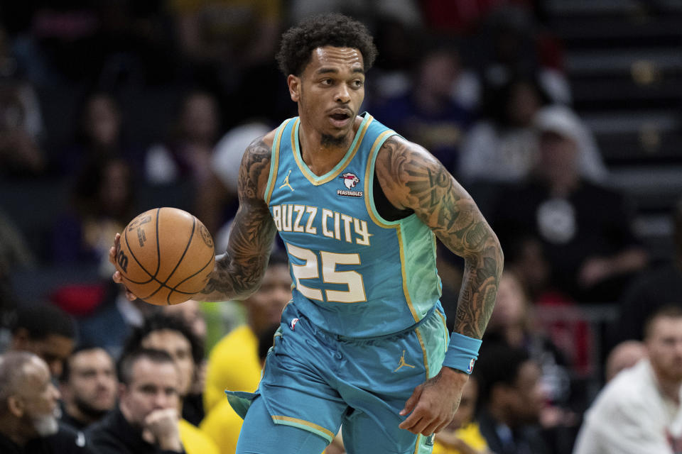 Charlotte Hornets forward P.J. Washington brings the ball up court during the first half of an NBA basketball game against the Los Angeles Lakers, Monday, Feb. 5, 2024, in Charlotte, N.C. (AP Photo/Jacob Kupferman)