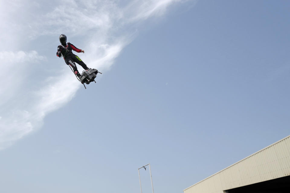 Franky Zapata, "Le Rocketman", a 40-year-old inventor, performs a training flight over the Saint Inglevert airport near Calais, Northern France, Wednesday July 24, 2019. Zapata, the man who wowed the crowd on Bastille Day, whirling over France’s invited leaders on his flyboard, is making final checks for his biggest challenge: soaring across the English Channel. Zapata is to take off on Thursday anchored to his flyboard _ a small flying platform he invented _ from Sangatte, in France’s Pas de Calais region, and hopes to land in the Dover area. (AP Photo/Michel Spingler)