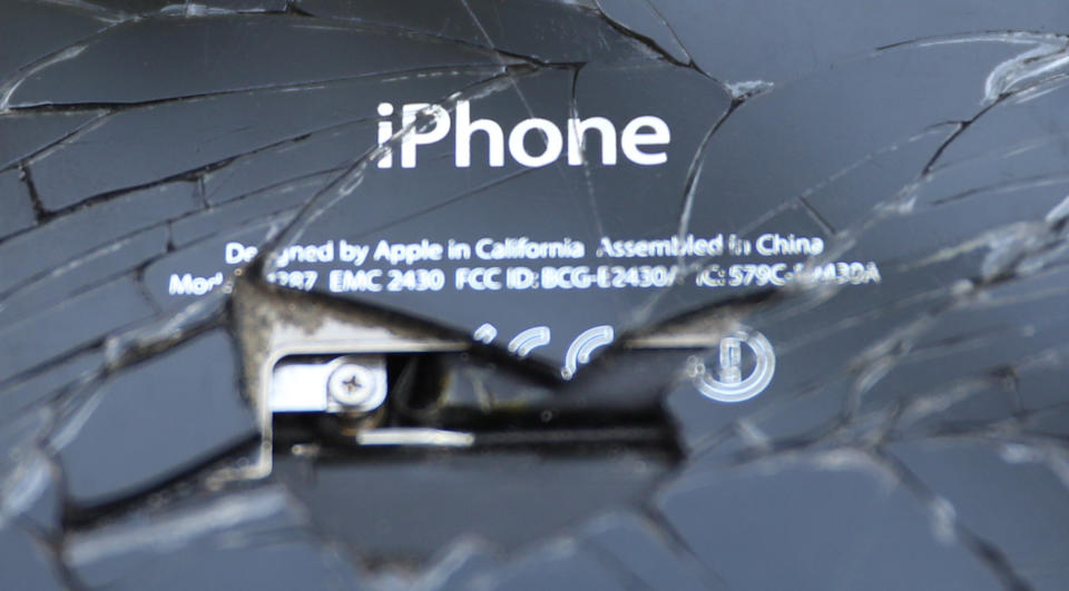 A broken iPhone is seen on a table in this illustration picture, October 21, 2017. REUTERS/Dado Ruvic