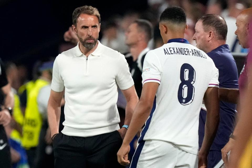 England's manager Gareth Southgate talks with Trent Alexander-Arnold during Tuesday’s match (AP)