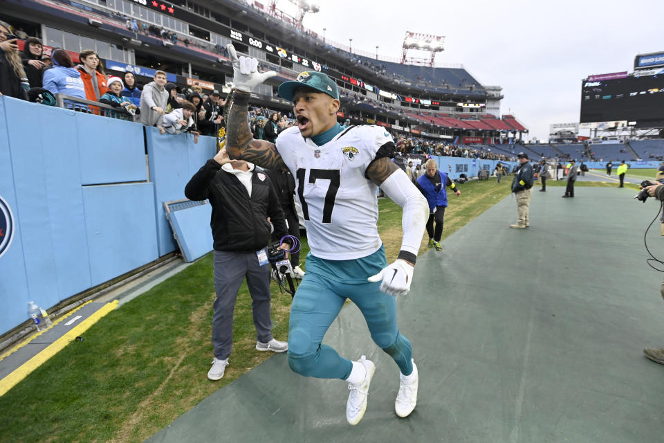 Jacksonville Jaguars tight end Evan Engram celebrates as he runs off the field a following 36-22 victory over the Tennessee Titans in an NFL football game Sunday, Dec. 11, 2022, in Nashville, Tenn. (AP Photo/Mark Zaleski)