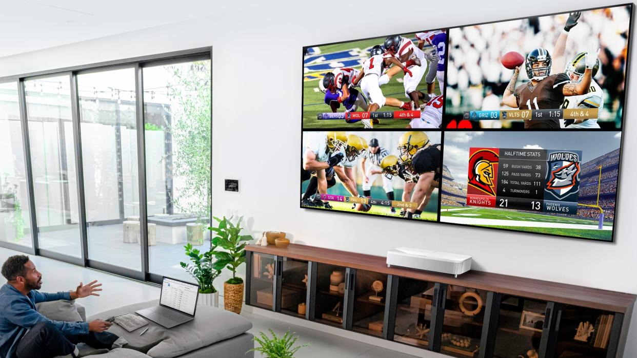  Epson LS800 projector showing football games on wall . 