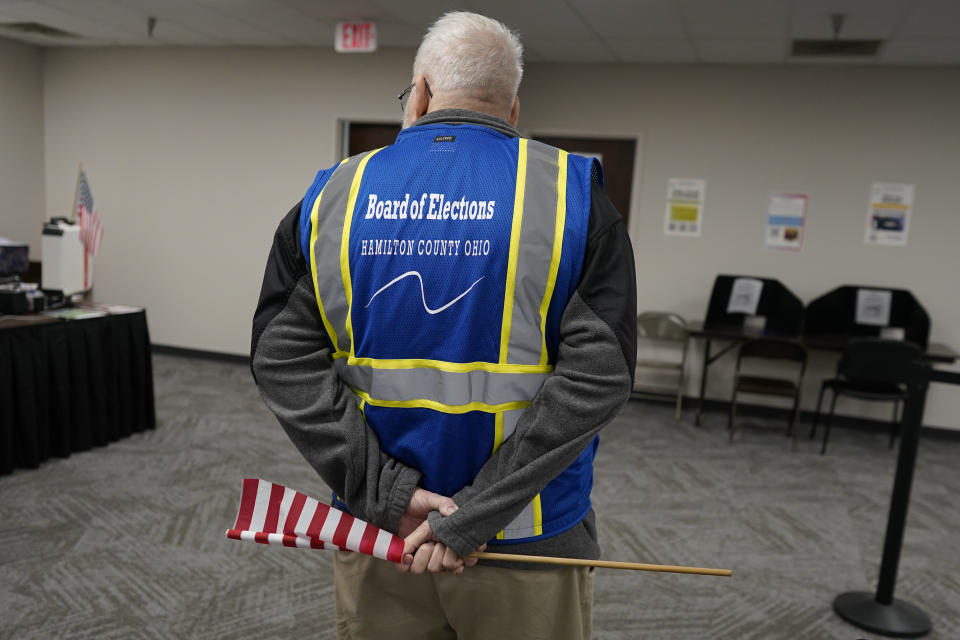 Poll worker Paul Sharp stands by to help voters during early in-person voting at the Hamilton County Board of Elections in Cincinnati, Wednesday, Oct. 11, 2023. (AP Photo/Carolyn Kaster)