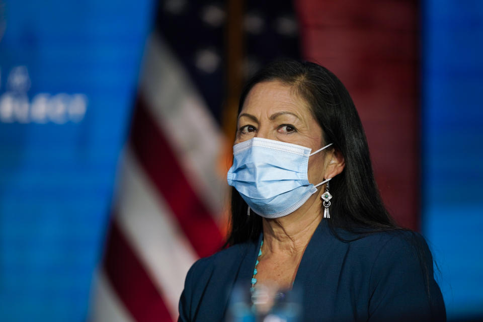 Rep. Deb Haaland, D-N.M., listens as President-elect Joe Biden announces her as his nominee for Secretary of Interior at The Queen Theater in Wilmington Del., Saturday, Dec. 19, 2020. (AP Photo/Carolyn Kaster)