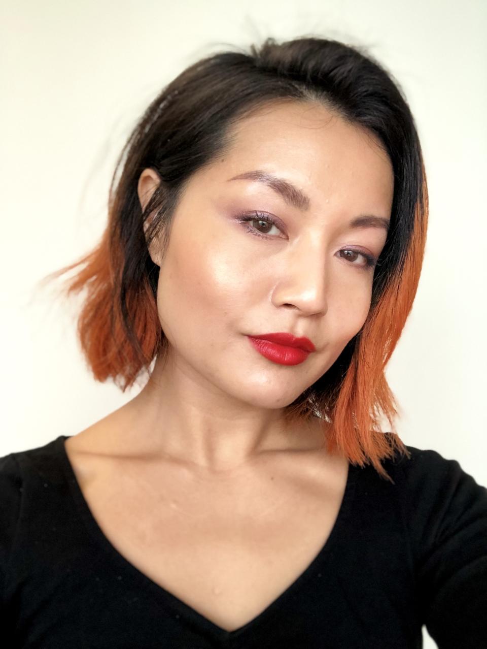 Allure digital makeup editor Sable Yong wears Park Avenue, a vibrant scarlet