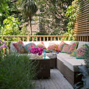 <p> If you're using decking to section off a corner of the garden, adding railings will help. For a truly indoor-meets-outdoor approach, include a water-resistant rattan sofa and plenty of comfy cushions in a patchwork of bright patterns. </p> <p> There is a lot of vivid colour to be found in nature, so they won't look out of place against the vibrant greens of surrounding trees. </p>