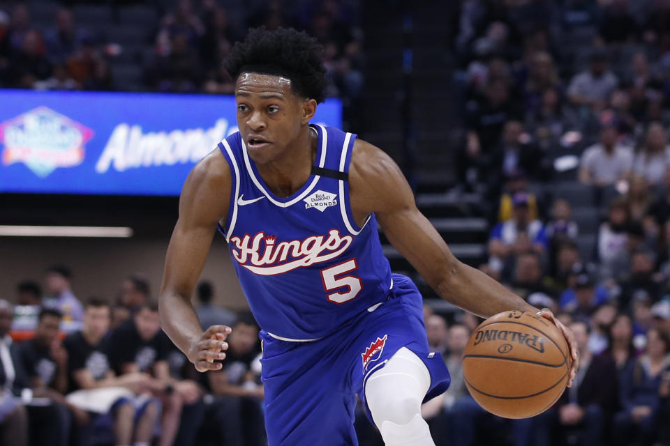 FILE - In this Feb. 20, 2020, file photo, Sacramento Kings guard De'Aaron Fox drives during the team's NBA basketball game against the Memphis Grizzlies in Sacramento, Calif. Fox agreed to a five-year, $163 million contract with the Kings on Friday, Nov. 20. (AP Photo/Rich Pedroncelli, File)