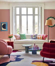 <p> Rose pink is a joyful wall color for a vibrant living space; seen here is Farrow & Ball’s Sulking Room Pink. It’s a surprisingly accommodating backdrop, sitting happily alongside the multitude of other shades in this colorful scheme – from emerald and cobalt to deep burgundy and gold – all tied together in this painterly rug from The Rug Company. </p>