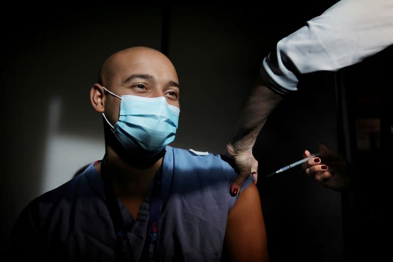 FILE PHOTO: COVID-19 vaccines are adminstered at Massachusetts General Hospital in Boston