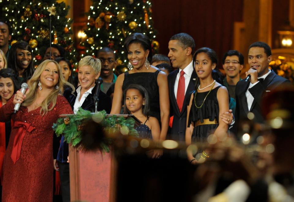 The singer, pictured with former US President Barack Obama and first lady Michelle Obama, their daughters Sasha and Malia and Ellen DeGenerous, after singing her famous track, All I Want For Christmas Is You, at Christmas In Washington celebration in 2010 (Getty Images)