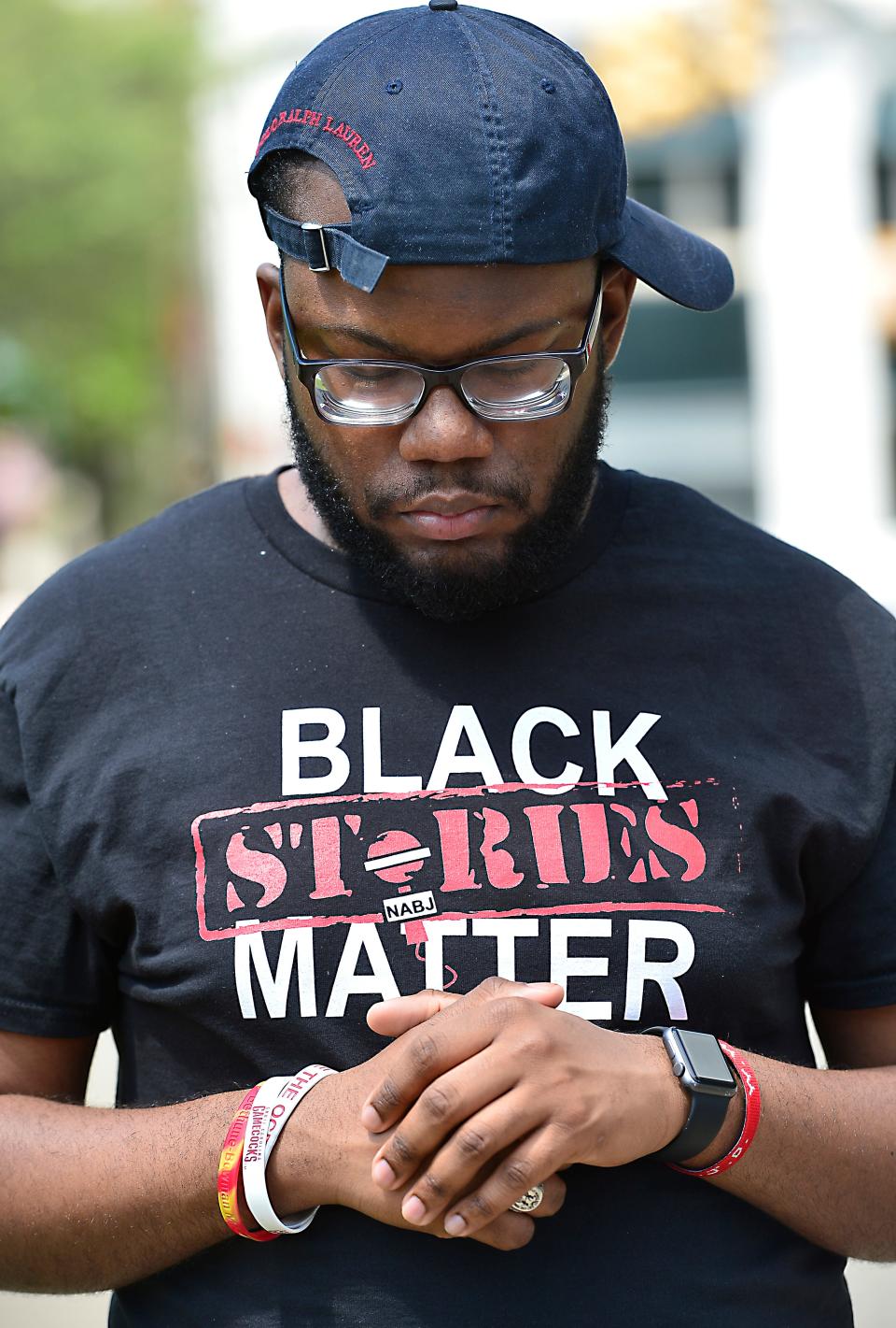 A rally protesting the planned firing squad execution of Richard Moore of Spartanburg took place at the South Carolina State House in Columbia on April 23, 2022. Isaac Mays, 22, of Bowman, S.C., takes a moment to himself at the event.  