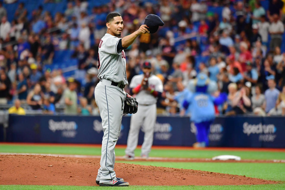 Carlos Carrasco of the Cleveland Indians tips his hat to manager Terry Francona before the seventh inning against the Tampa Bay Rays at Tropicana Field Sunday in St Petersburg, Florida.