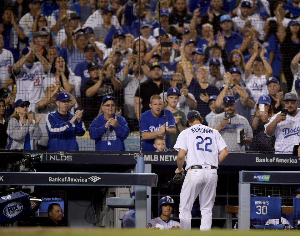 Fans cheer as Los Angeles Dodgers starting pitcher Clayton Kershaw leaves the game during the ninth inning of Game 2 of a baseball National League Division Series against the Atlanta Braves on Friday, Oct. 5, 2018, in Los Angeles. (AP Photo/Mark J. Terrill)