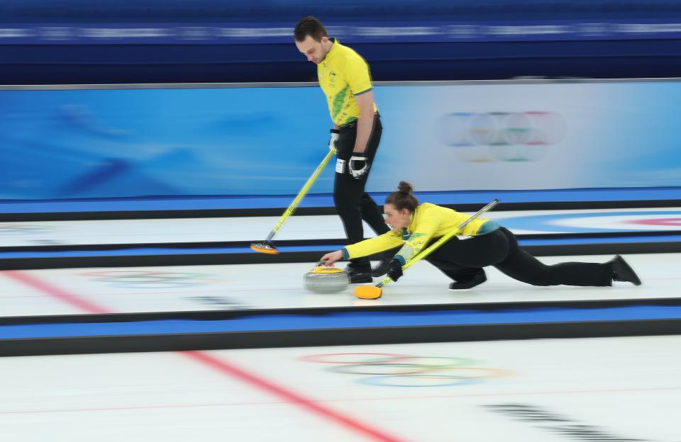 Dean Hewitt of Team Australia and Tahli Gill of Team Australia compete against Team Sweden during the Curling Mixed Doubles on 4 February 2022 (Getty Images)