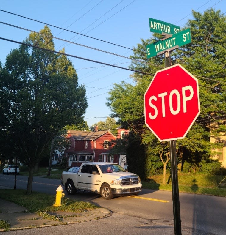 A truck drives by a 25 mph sign on East Walnut Street, one of the many side streets in the city that Ashland council members mentioned has problems with speeders.