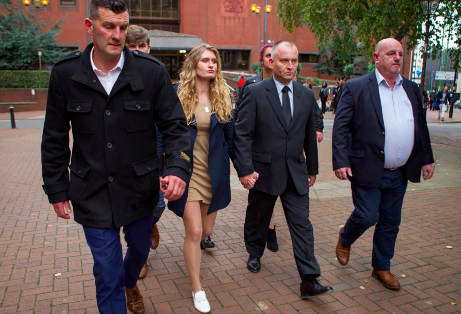 <em>Peter Wilkinson (2nd from right) holds hands with daughter Lydia, 19, as they arrive in court (SWNS)</em>