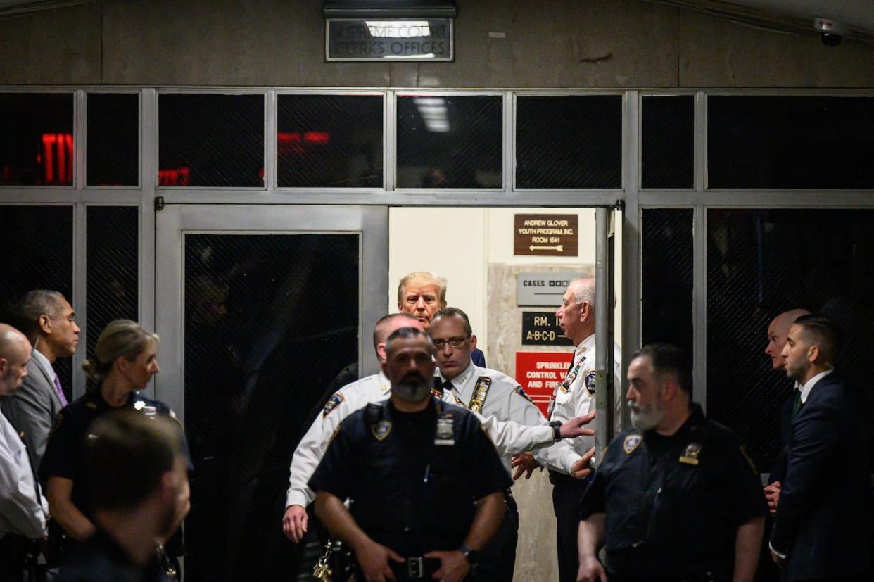 Former President Donald Trump arrives at the Manhattan Criminal Courthouse on April 4, 2023, before his arraignment. <a href="https://media.gettyimages.com/id/1250781316/photo/topshot-us-politics-trump-indictment.jpg?s=612x612&w=gi&k=20&c=I3u5rvs60DqqaqFP2vww4C8zLbH9OezJU37hQ-vKRgI=" rel="nofollow noopener" target="_blank" data-ylk="slk:Ed Jones/AFP via Getty Images;elm:context_link;itc:0;sec:content-canvas" class="link ">Ed Jones/AFP via Getty Images</a>