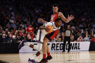 Kansas State's Nae'Qwan Tomlin (35) drives the ball against Florida Atlantic's Vladislav Goldin (50) in the first half of an Elite 8 college basketball game in the NCAA Tournament's East Region final, Saturday, March 25, 2023, in New York. (AP Photo/Adam Hunger)