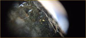 HOLE 22ZS011 – VISIBLE GOLD IN CENTIMETRE-SCALE CROSS-CUTTING SILICIFIED VEINLET WITHIN HYDROTHERMALLY ALTERED PERTHITIC GRANITE