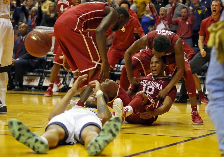 Jordan Woodard hit three massive shots charging towards the basket late in the Sooners' upset of West Virginia. (Getty)