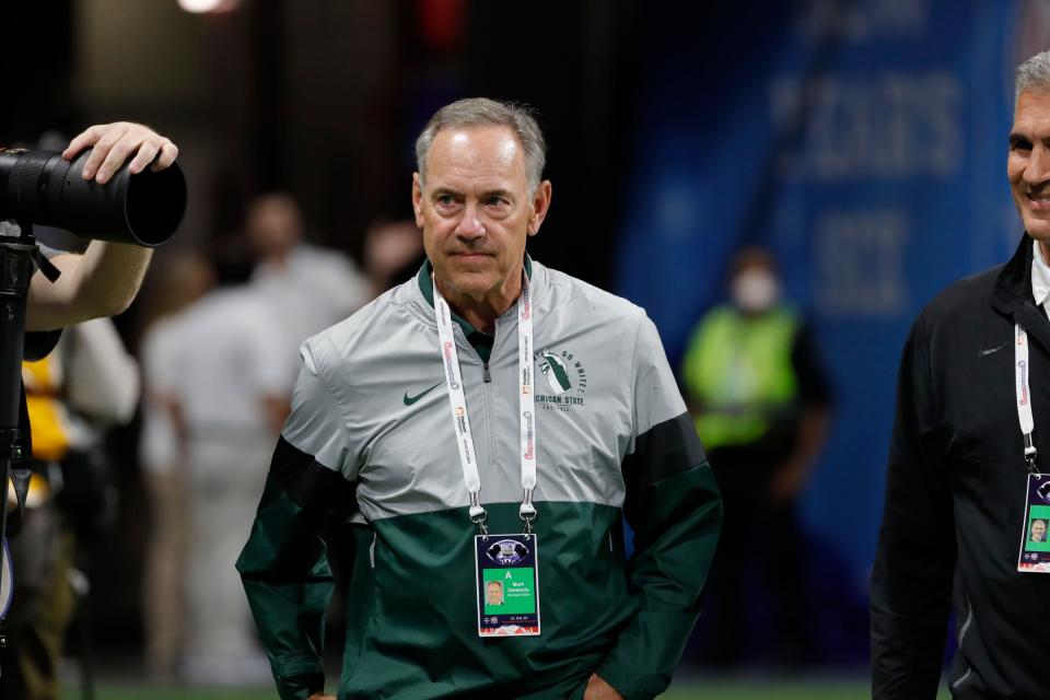 Former Michigan State coach Mark Dantonio watches warm up before the Peach Bowl against Pittsburgh at the Mercedes-Benz Stadium in Atlanta on Thursday, Dec. 30, 2021.