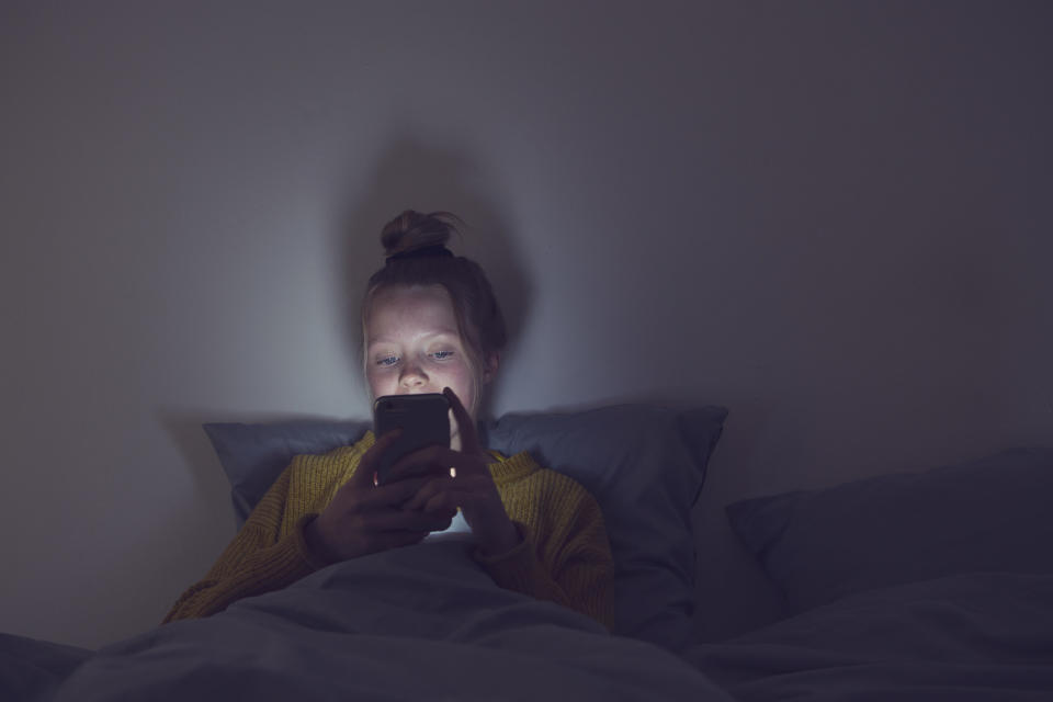 A young girl on her phone