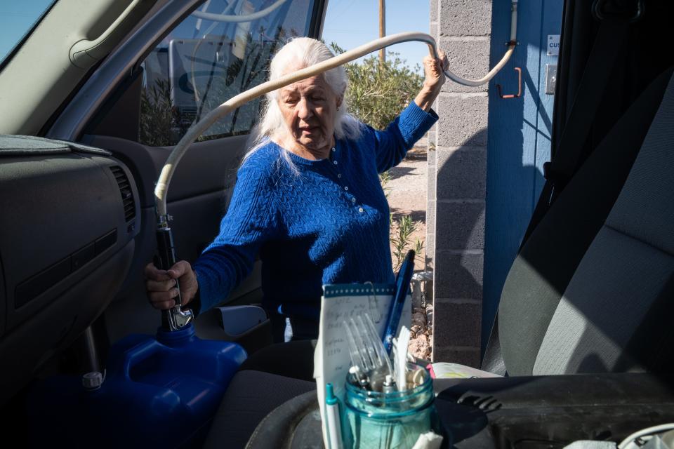 Judy Thomsen (resident) gets drinking water, March 1, 2022, at the Bouse RV Park, 44255 Winters Street, Bouse, Arizona.