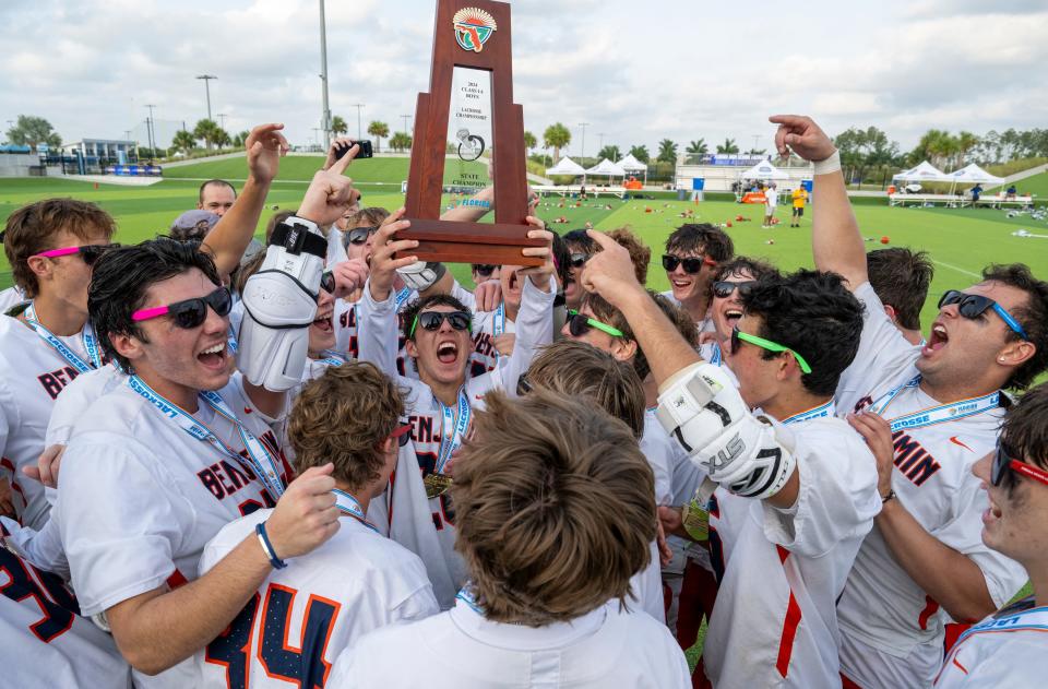 The Benjamin School players celebrate after winning the Class 1A state championship game over Community School of Naples in Naples on Saturday evening, May 11, 2024. Photo by Darron R. Silva