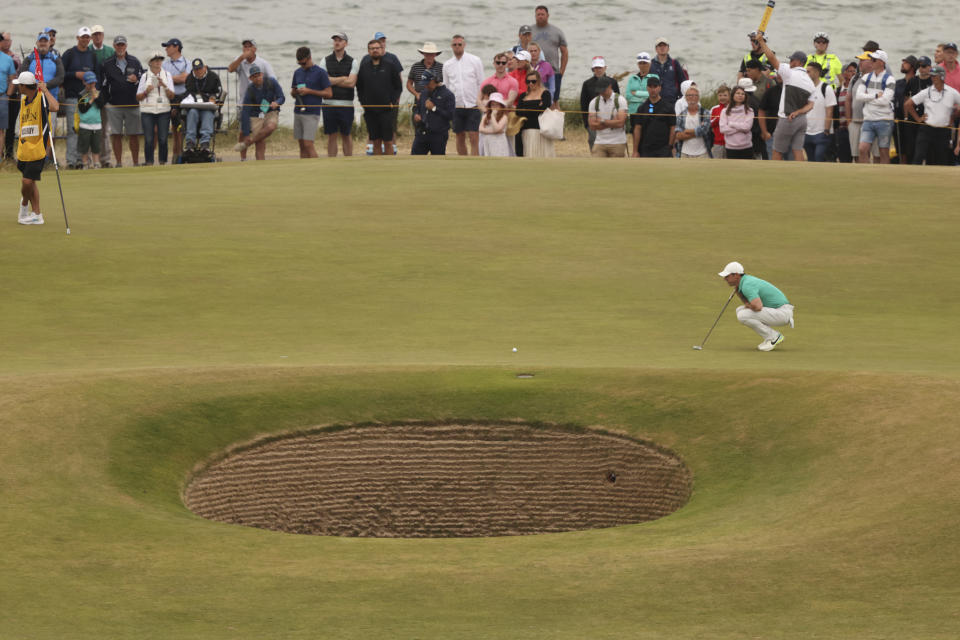 Rory McIlroy of Northern Ireland lines up a putt on the 11th hole during the third round of the British Open golf championship on the Old Course at St. Andrews, Scotland, Saturday July 16, 2022. (AP Photo/Peter Morrison)