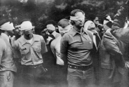 A file photo taken on November 4, 1979 shows staffers of the US embassy in Tehran blindfolded and handcuffed after Iranian revolutionary students stormed the American embassy and took them hostage